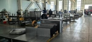 Material preparation area with organized packing supplies and storage shelves